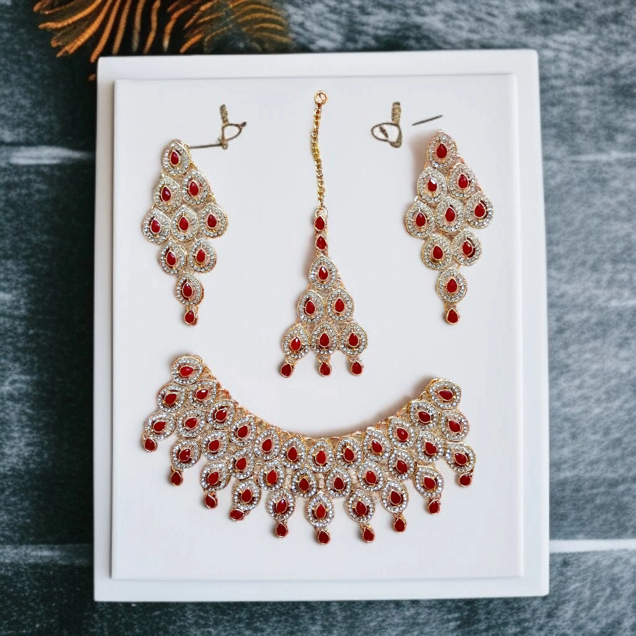 Buy Maroon colour jewellery set with necklace , earrings and tikka at best price in pakistan